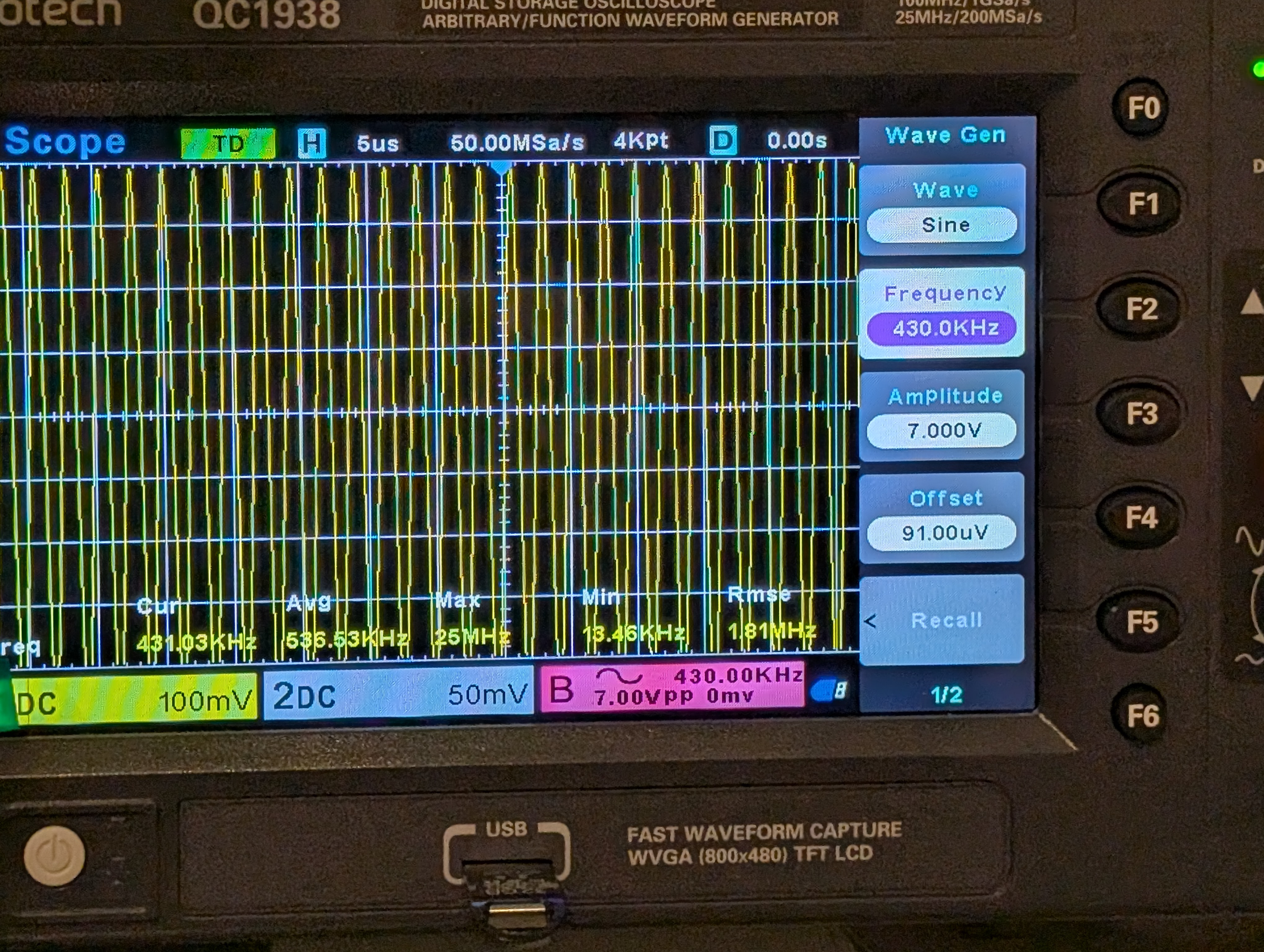 Oscilloscope reading at 430 kHz showing peak resonant response